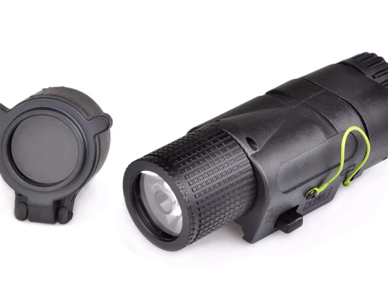 Black tactical flashlight with a lens cap on a white background